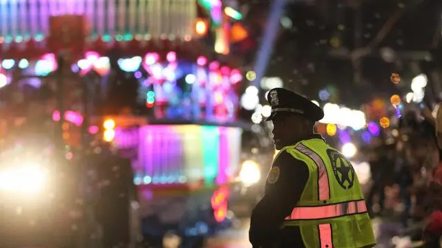 epa05815553 A member of the New Orleans Police Department (NOPD) works the parade route as the Krewe of Endymion Mardi Gras Parade rolls in New Orleans, Louisiana, USA, 25 February 2017. According to reports, dozens of people were injured after a pickup truck slammed into a crow in the Mid-City section of New Orleans during a parade on 25 February 2017. A man was taken into custody and police was said to investigate the suspect for driving while intoxicated, media added. New Orleans is celebrating Mardi Gras leading up to the last day of Carnival on Fat Tuesday. EPA/DAN ANDERSON