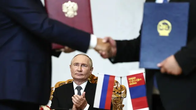 epa11582233 Russian President Vladimir Putin gestures as he attends a signing ceremony, in Ulaanbaatar, Mongolia, 03 September 2024. Putin visits Mongolia in his first trip to a member state of the International Criminal Court (ICC) since the court issued an arrest warrant for him last year. EPA/SOFIA SANDURSKAYA /SPUTNIK/KREMLIN POOL MANDATORY CREDIT