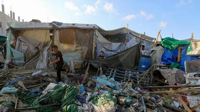 epa11586177 Internally displaced Palestinians inspect destroyed shelters following an Israeli military strike near Al-Aqsa Martyrs Hospital in Deir Al Balah, central Gaza Strip, 05 September 2024. According to the Palestinian Ministry of Health in Gaza, more than four Palestinians were killed after an Israeli air strike hit near the hospital. The Israeli military stated that it conducted a 'targeted' airstrike overnight on a 'Command and Control Center' used by Hamas and Islamic Jihad, which was embedded in the humanitarian area in Deir Al Balah, to 'remove an immediate threat', adding that prior to the strike 'numerous steps' were taken to mitigate the risk of harming civilians. More than 40,000 Palestinians and over 1,400 Israelis have been killed, according to the Palestinian Health Ministry and the Israel Defense Forces (IDF), since Hamas militants launched an attack against Israel from the Gaza Strip on 07 October 2023, and the Israeli operations in Gaza and the West Bank which followed it. EPA/MOHAMMED SABER