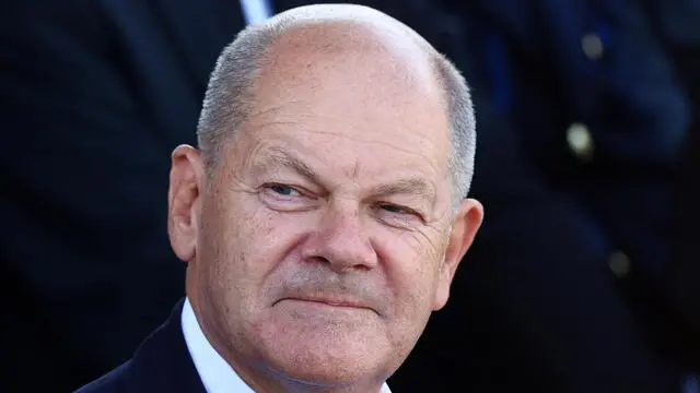 epa11584588 German Chancellor Olaf Scholz attends the ceremonial commissioning of a IRIS- T SLM air defense system at the Todendorf barracks in Todendorf, Northern Germany, 04 September 2024. The IRIS-T SLM system is being introduced into the German Army (Bundeswehr) air defense missile group 61. EPA/FILIP SINGER