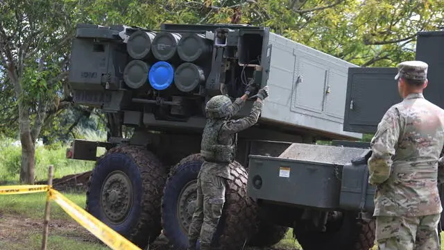 epa11539277 A handout photo made available by the Philippine Army shows Philippine Army personnel inspecting hardware and system of the High Mobility Artillery Rocket System (HIMARS) during the live fire exercises at Canantong Fire Base in Laur, Nueva Ecija province, Philippines, 09 August 2024. Soldiers of the Philippine Army and US Army Pacific conducted exercises as part of the ongoing SALAKNIB Phase 2, a bilateral training designed to enhance interoperability and readiness. EPA/PHILIPPINE ARMY HANDOUT BEST QUALITY AVAILABLEHANDOUT EDITORIAL USE ONLY/NO SALES