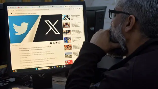 epa11169744 A man reads news of social media platform X (formerly Twitter) blockade on a computer in Peshawar, Pakistan, 21 February 2024. Pakistani authorities have restricted access to the social media platform X following widespread allegations of electoral fraud in the contentious parliamentary polls held on 08 February, according to Pakistan Human Rights Commission (HRCP). Reports from Pakistani users indicated that access to the social media platform was blocked in various parts of the country, as confirmed by the Downdetector portal, which showed X remained largely inaccessible since 19 February. EPA/BILAWAL ARBAB