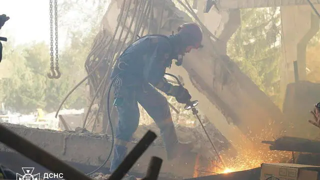 epa11586363 A handout photo released by the press service of the State Emergency Service (SES) of Ukraine shows Ukrainian rescuers working at the site of a rocket strike in Poltava, central Ukraine, 05 September 2024, amid the Russian invasion. As a result of a Russian rocket attack on 03 September 2024, the six-story building of the educational building was partially destroyed, three apartment buildings, five private houses and an office building were damaged. The death toll from a Russian strike on an educational institution in Poltava rose to at least 54 dead and 297 injured, SES said. Ukrainian rescuers continued to work at the site of the attack, where five more people are feared to be trapped under the rubble. Russian troops entered Ukrainian territory on 24 February 2022, starting a conflict that has provoked destruction and a humanitarian crisis. EPA/STATE EMERGENCY SERVICE OF UKRAINE HANDOUT -- BEST QUALITY AVAILABLE -- MANDATORY CREDIT: STATE EMERGENCY SERVICE OF UKRAINE -- HANDOUT EDITORIAL USE ONLY/NO SALES