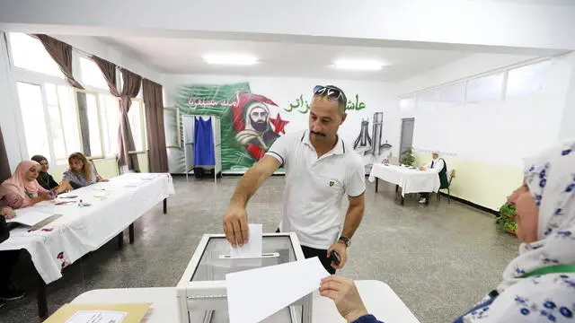 epa11590801 A voter casts his ballot at a polling station during a presidential election in Algiers, Algeria, 07 September 2024. According to the National Independent Authority for Elections (ANIE), more than 24 million Algerians are called to the polls to elect a new president of the republic for a five-year term. Three candidates are in the running for this election; the national secretary of the Socialist Forces Front (FFS), Youcef Aouchiche, the president of the Movement of Society for Peace (MSP), Abdelaali Hassani Cherif, and the current president, Abdelmadjid Tebboune. EPA/MOHAMED MESSARA