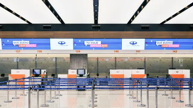 epa11186743 The Ministro Pistarini International Airport without lines of passengers or employees at the counters during a day of strike, in Ezeiza, province of Buenos Aires, Argentina, 28 February 2024. Thousands of passengers were stranded on the ground in Argentina, unable to board their national and international flights due to the 24-hour strike carried out by aviation unions to demand better wages. The flag carrier Aerolineas Argentinas canceled 331 flights on 28 February as a result of the force measure, which it estimated will affect around 24,000 passengers. In addition, 10,000 passengers made voluntary changes to their flights in recent days. EPA/LUCIANO GONZALEZ