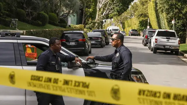 epa11243724 Police officers block a street as federal investigators conduct a raid of a home owned by rapper and record producer Sean 'Diddy' Combs in Los Angeles, California, USA, 25 March 2024. The United Statesâ€™ Department of Homeland Security confirmed that the raid on Combs home was part of an ongoing investigation. EPA/CAROLINE BREHMAN