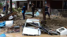 epa08619423 People stand on a flooded-hit street following heavy rainfall in Dereli district of Giresun, Turkey, 23 August 2020. According to media reports at least 4 people have died in the flood disaster that occurred, 11 people are still missing. TURKEY OUT, USA OUT, UK OUT, CANADA OUT, FRANCE OUT, SWEDEN OUT, IRAQ OUT, JORDAN OUT, KUWAIT OUT, LEBANON OUT, OMAN OUT, QATAR OUT, SAUDI ARABIA OUT, SYRIA OUT, UAE OUT, YEMEN OUT, BAHRAIN OUT, EGYPT OUT, LIBYA OUT, ALGERIA OUT, MOROCCO OUT, TUNISIA OUT, AZERBAIJAN OUT, ALBANIA OUT, BOSNIA HERZEGOVINA OUT, BULGARIA OUT, KOSOVO OUT, CROATIA OUT, MACEDONIA OUT, MONTENEGRO OUT, SERBIA OUT, TURKEY OUT, USA OUT, UK OUT, CANADA OUT, FRANCE OUT, SWEDEN OUT, IRAQ OUT, JORDAN OUT, KUWAIT OUT, LEBANON OUT, OMAN OUT, QATAR OUT, SAUDI ARABIA OUT, SYRIA OUT, UAE OUT, YEMEN OUT, BAHRAIN OUT, EGYPT OUT, LIBYA OUT, ALGERIA OUT, MOROCCO OUT, TUNISIA OUT, AZERBAIJAN OUT, ALBANIA OUT, BOSNIA HERZEGOVINA OUT, BULGARIA OUT, KOSOVO OUT, CROATIA OUT, MACEDONIA OUT, MONTENEGRO OUT, SERBIA OUT, SHUTTERSTOCK OUT EPA/BARIS ORAL SHUTTERSTOCK OUT