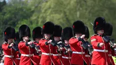 epa09906852 The Grenadier Guards perform the Changing of the Guard outside Buckingham Palace in London, Britain, 24 April 2022. The Changing of the Guard is a traditional military ceremony carried out daily where a group of soldiers who protect Buckingham Palace are replaced by a new group of soldiers. The Grenadier guards have protected British Kings and Queens at various royal palaces since 1656. EPA/ANDY RAIN