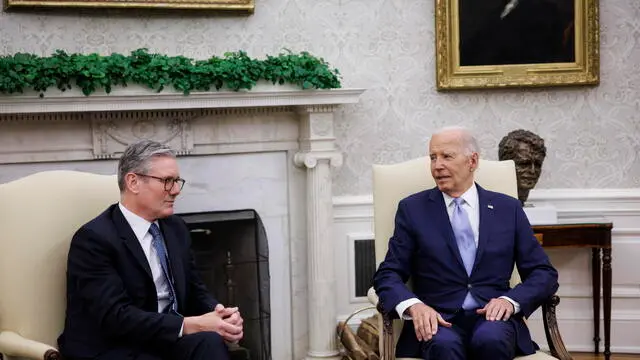 epa11471648 US President Joe Biden (R) and UK Prime Minister Keir Starmer (L) participate in a bilateral meeting at the Oval Office of the White House in Washington, DC, USA, 10 July 2024. Starmer stated he would publish a roadmap showing how the UK would spend 2.5 percent of its gross domestic product on defense as the prime minister faced calls from the British military and allies abroad to clarify his policy ahead of this week's NATO summit in Washington. EPA/TING SHEN / POOL