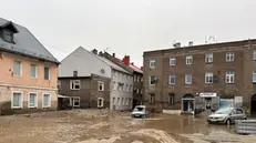 epa11606607 Damages on flooded streets after heavy rainfalls in Glucholazy, southwestern Poland, 15 September 2024. The southern regions of Poland are experiencing record rainfall and severe flooding caused by heavy rains from the Genoese depression "Boris", which reached Poland on Thursday, September 12. People in flooded areas of the region are being forced to evacuate, and water is flooding villages and towns. River levels are at or above alarming levels. Poland's prime minister confirmed on September 15 that one person had died as a result of the flooding. EPA/MICHAL MEISSNER POLAND OUT