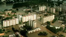 Aerial view taken 11 July showing a flooded residential district in Opole, southern Poland. The death toll in Poland resulting from devastating floods which have swept central Europe for a week, has gone up to 23. Torrential rains which stopped Thursday have left 50 towns and some 300 villages under water in Poland.