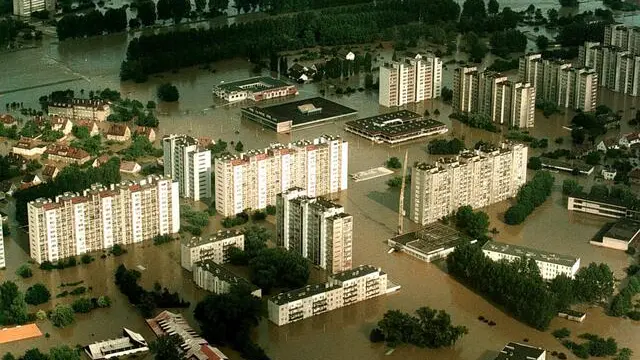 Aerial view taken 11 July showing a flooded residential district in Opole, southern Poland. The death toll in Poland resulting from devastating floods which have swept central Europe for a week, has gone up to 23. Torrential rains which stopped Thursday have left 50 towns and some 300 villages under water in Poland.