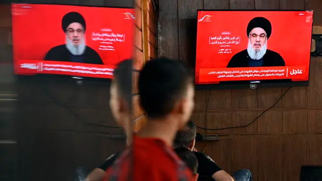 epa11614056 People watch Hezbollah Secretary-General Hassan Nasrallah delivering a televised speech at a coffee shop in the southern suburb of Beirut, Lebanon, 19 September 2024. Nasrallah commented on the explosions condemning Israel. Hezbollah declared in a statement that Israel was behind the strike and that there will be consequences. Lebanon's Health Minister Firas Abiad said on 19 September that at least 37 people died and more than 2900 others injured after multiple wireless communication devices were detonated on 17 and 18 September. EPA/WAEL HAMZEH