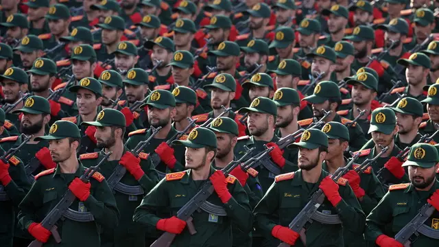 epa11616737 Iranian Revolutionary Guard Corps (IRGC) soldiers march in formation during the annual military parade marking the Iraqi invasion in 1980, which led to an eight-year-long war (1980-1988); in Tehran, Iran, 21 September 2024. According to IRNA newes agency, Iranian president Masoud Pezeshkian said 'our defense system power is on that level that no enemy even dares to think to attack against Iran, and we will continue to develop our defense system in any aspects.' EPA/ABEDIN TAHERKENAREH