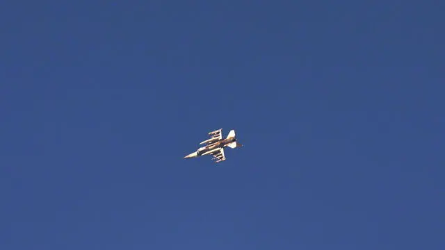 epa11465739 An Israeli fighter jet flies over an area in southern Lebanon, as seen from an undisclosed location in northern Israel, 07 July 2024. The Israeli military stated on 07 July, that its Aerial Defense Array intercepted a 'suspicious aerial target' in the area of the Golan Heights that crossed from Lebanese territory. EPA/ATEF SAFADI