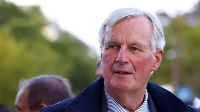 epa11604120 France's Prime minister Michel Barnier looks on during a parade of French athletes who participated in the 2024 Olympics and Paralympics in Paris, France, 14 September 2024. EPA/SARAH MEYSSONNIER / POOL MAXPPP OUT