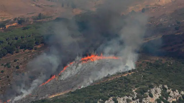 epa11621931 Smoke and fire are seen at the site of an Israeli airstrike that targeted Lebanese villages, as seen from Marjaayoun, southern Lebanon, 24 September 2024. Thousands of people fled southern Lebanon after an evacuation warning by the Israeli army, which on 23 September announced that it had launched 'extensive' airstrikes on Hezbollah targets in the country. According to Lebanon's Ministry of Health, at least 492 people have been killed and more than 1,645 have been injured following continued airstrikes on southern Lebanese towns and villages. EPA/STR