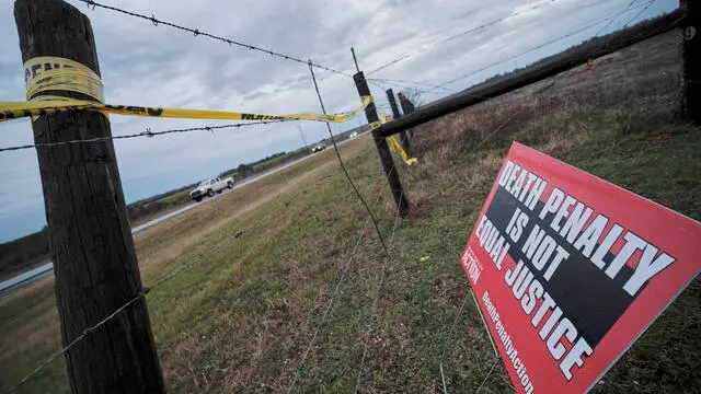 epa11104545 A protest sign against the death penalty is displayed outside of the W.C. Coleman Correction Facility where the State of Alabama is planning the execution of convicted killer Kenneth Eugene Smith in Atmore, Alabama, USA, 25 January 2024. There have been protests by several human rights groups who claim the experimental method of using nitrogen gas hypoxia to execute people may not work. EPA/DAN ANDERSON