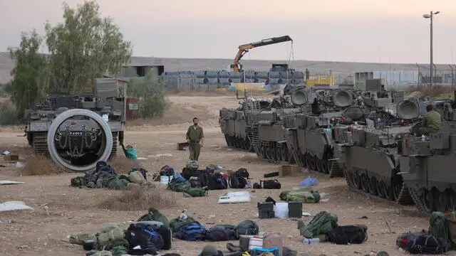 epaselect epa10909663 Israeli reservists prepare next to armored personnel carriers (APCs) at a military camp near Beer Sheva, Israel, 09 October 2023. Israeli chief military spokesperson Rear-Admiral Daniel Hagari said on 09 October that the country had drafted a record of 300,000 reservists. More than 700 Israelis were killed and over 2,000 were injured since the Islamist movement Hamas carried out an unprecedented attack on southern Israel on 07 October, the Israeli army said. According to Palestinian officials, more than 500 people were killed and nearly 3,000 were injured as a result of Israelâ€™s retaliatory raids and air strikes in the Palestinian enclave. EPA/ABIR SULTAN