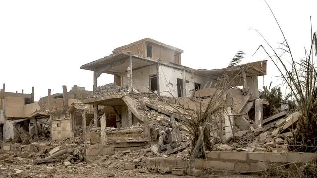 epa06346938 An undated handout photo made available on 23 November 2017 by the Syriaâs Arab News Agency (SANA) showing the damage buildings in the vicinity of Al-Boukamal city in the countryside of Deir Ezzor, Syria. According to SANA Russian strategic bombers destroyed on 17 November command sites, gatherings, and armored vehicles for Daesh (ISIS) terrorist organization in the vicinity of al-Boukamal city in the countryside of Deir Ezzor. The Russian Defense Ministry said in a statement that on November 17th 2017, six Tupolev-22M3 long-range bombers left an airbase in Russia, crossed Iranian and Iraqi airspace, and carried out a massive airstrike against facilities of the terrorist organization Daesh near Abu Kamal, in Syriaâs Deir Ezzor province, and the targets included strongholds, manpower, and armored vehicles. EPA/SANA / HANDOUT HANDOUT EDITORIAL USE ONLY/NO SALES