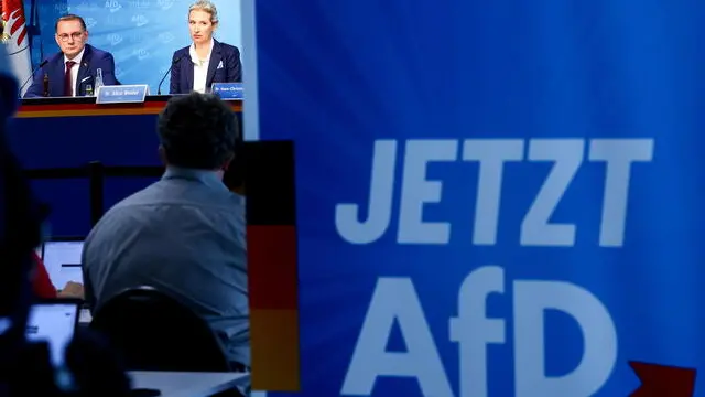 epa11620263 Alternative for Germany (AfD) right-wing political party co-chairman, Tino Chrupalla (L), and AfD deputy chairwoman, Alice Weidel (R), attend an attend an AfD party press conference in Berlin, 23 September 2024. The far-right Alternative for Germany (AfD) has taken second place in the state elections in Brandenburg, behind the Social Democratic Party (SPD), with 29 percent of the vote. EPA/Filip Singer