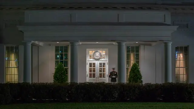 epa11277474 A Marine is posted outside the West Wing entrance of the White House, indicating that President Biden is present, in Washington, DC, USA, 13 April 2024. President Biden has returned to Washington a day early to consult with his national security team in the Situation Room after both Iran and Israel announced that Iran had launched drones and rockets towards Israel. EPA/SHAWN THEW