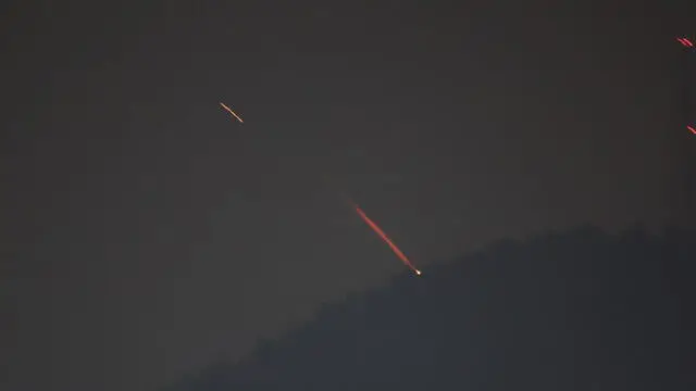 epa11277422 A view shows drones or missiles vying for targets at undisclosed locations in northern Israel, early 14 April 2024. According to the Israeli army IDF on early 14 April Iran launched missiles from its territory toward the territory of the State of Israel. The IDF called called for people to be alert and act according to the Home Front Command’s guidelines. EPA/ATEF SAFADI