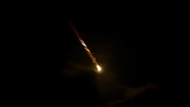 epa11636219 A projectile flies over the Upper Galilee, northern Israel, 01 October 2024. Israel's military stated that Iran has launched missiles towards the State of Israel on 01 October, and asked citizens to 'remain vigilant' and to follow the Home Front Command's instructions directing people to protected areas and remain there 'until further instructions' are given. EPA/ATEF SAFADI