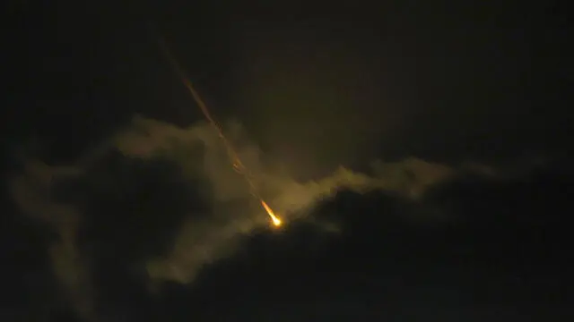 epa11636225 A projectile flies over the Upper Galilee, northern Israel, 01 October 2024. Israel's military stated that Iran has launched missiles towards the State of Israel on 01 October, and asked citizens to 'remain vigilant' and to follow the Home Front Command's instructions directing people to protected areas and remain there 'until further instructions' are given. EPA/ATEF SAFADI
