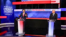 epa11636940 Republican vice presidential nominee JD Vance (L), and Minnesota Governor and Democratic vice presidential nominee Tim Walz (R) during the Vice Presidential debate at the CBS Broadcast Center in New York, New York, USA, 01 October 2024. EPA/SARAH YENESEL