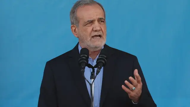 epa11616681 Iranian president Masoud Pezeshkian speaks during the annual military parade marking the Iraqi invasion in 1980, which led to an eight-year-long war (1980-1988); in Tehran, Iran, 21 September 2024. According to IRNA newes agency, Iranian president Masoud Pezeshkian said 'our defense system power is on that level that no enemy even dares to think to attack against Iran, and we will continue to develop our defense system in any aspects.' EPA/ABEDIN TAHERKENAREH