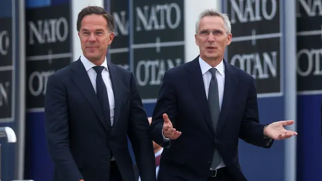 epa11634847 Former Dutch Prime Minister Mark Rutte (L) and Jens Stoltenberg speak to each other on the day Rutte succeeds Stoltenberg as NATO Secretary General, at the Alliance headquarters in Brussels, Belgium, 01 October 2024. Former Dutch Prime Minister Mark Rutte succeeds Jens Stoltenberg as Secretary General of the North Atlantic Treaty Organization (NATO) on 01 October 2024 after the latter's ten years at the helm of the Alliance. EPA/OLIVIER HOSLET