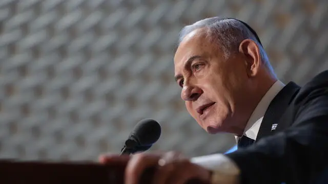 epa11481838 Israeli Prime Minister Benjamin Netanyahu addressing a memorial ceremony marking a decade for Israeli fallen soldiers of the 2014 Gaza War also known as Operation Protective Edge, in the Hall of Remembrance at the Mount Herzl Military Cemetery in Jerusalem, 16 July 2024. Israelâ€™s Protective Edge military operation lasted 50 days in the Gaza Strip, 70 Israeli soldiers and five civilians were killed during the war according to the Israeli army spokesman. EPA/ABIR SULTAN / POOL