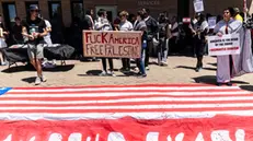 epa11643310 Protesters hold placards as they demonstrate outside the US Consulate, in Johannesburg, South Africa, 05 October 2024. The march, organized by the Palestine Solidarity Campaign (PSC), was held to express solidarity with Palestinian people, one year after the start of the Israel-Gaza conflict, and to call for an end to hostilities in the Middle East. In Cape Town, a march to the Houses of Parliament organized by the same movement was expected to draw thousands. Upcoming 07 October 2024, marks one year since the Palestinian militant group Hamas launched a surprise attack on Israel, killing 1,200, and one year since Israel began its war on Gaza, killing more than 41,000 and destroying the Palestinian enclave. EPA/KIM LUDBROOK