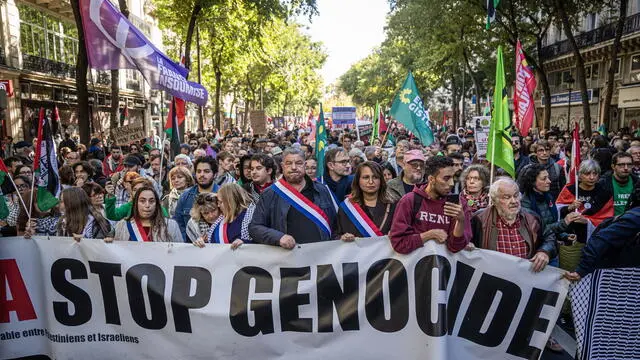 epa11643427 Members of the left-wing party La France Insoumise (LFI) walk behind a banner reading 'Stop Genocide' during a protest march in support of the Palestinian and Lebanese people in Paris, France, 05 October 2024. Upcoming 07 October 2024 marks one year since the Palestinian militant group Hamas launched a surprise attack on Israel, killing 1,200, and one year since Israel began its military operations on Gaza, killing more than 41,000 and destroying the Palestinian enclave. Lebanese Minister of Health Firas Abiad announced on 04 October 2024 that nearly 2,000 people have been killed and more than 9,300 others have been injured in Lebanon since the recent escalation of the Hezbollah-Israeli conflict. EPA/CHRISTOPHE PETIT TESSON