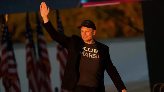 epa11644530 Businessperson Elon Musk at the Butler Farm Show where former US President and Republican presidential nominee Donald Trump held a rally in Butler, Pennsylvania, USA, 05 October 2024. The rally is taking place at the same location where a gunman attempted to assassinate former president Trump in July. EPA/WILL OLIVER