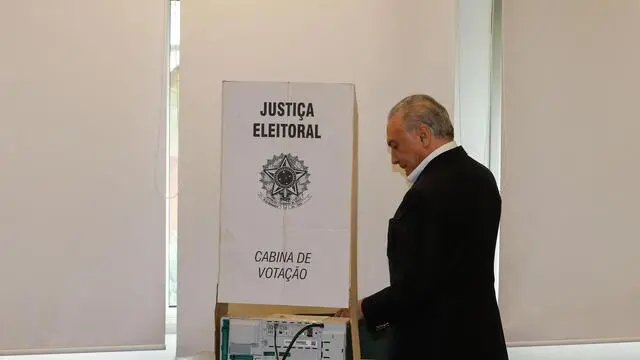 epa07127167 A handout photo made available by Agencia Brasil shows Brazilian President Michel Temer casting his ballot for the second round of the country's presidential election, at a polling station in Sao Paulo, Brazil, 28 October 2018. Around 147 million people are called to vote in the second round of the presidential election, in which 14 governors will also be elected. EPA/Cesar Itibere / HANDOUT EDITORIAL USE ONLY/NO SALES/NO FILE HANDOUT EDITORIAL USE ONLY/NO SALES/NO ARCHIVES