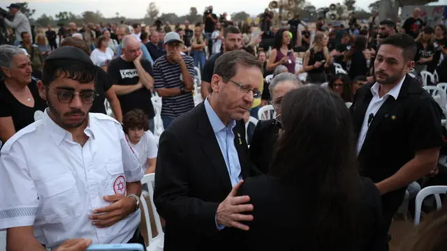 epa11646663 Israeli President Isaac Herzog embraces a family member of victims killed at the Supernova music festival while attending a gathering in memory of their relatives, at the Supernova memorial site for the victims of the 07 October 2023 Supernova music festival attack, near Kibbutz Re'im, close to the border with the Gaza Strip, in southern Israel, 07 October 2024. According to Israeli police, more than 360 Israelis were killed at the SuperNova music festival on 07 October 2023 by Hamas militants that stormed the area during a surprise attack launched from the Gaza Strip. October 07, 2024 marks one year since the Palestinian militant group Hamas launched a surprise attack on Israel, killing 1,400, and one year since Israel began its war on Gaza, killing more than 41,000 and destroying the Palestinian enclave. EPA/ABIR SULTAN