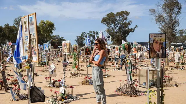 epa11641457 A woman looks at pictures and memorials for Israeli festival goers who killed by Hamas at the site of the Supernova Music Festival rave near Kibbutz Reim, Southern Israel, 19 September 2024. On 7 October 2023, the Palestinian group Hamas launched a coordinated attack from Gaza into Israel, with thousands of rockets fired and with militantsâ€™ staging land incursions into kibbutz communities and cities. The participants of the Nova music festival were also among other targets in the area of southern Israel bordering Gaza. The unprecedented attack was followed by an air and land offensive of the Israeli Army in the Gaza Strip, with massive displacement of its population and tens of thousands killed in almost one year of conflict. According to Israeli official sources, 1,139 people were killed in the Hamas attack including 695 Israeli civilians and 71 foreigners as well as 373 members of the security forces. Hamas militants also took 251 hostages, 117 of which have been released alive with 37 dead. The rest remain in captivity. After one year of war, the death toll reached 1,638 in Israel, among them 860 civilians, according to the National Insurance Office. EPA/ABIR SULTAN ATTENTION: This Image is part of a PHOTO SET