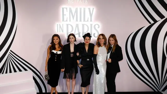 epa11601192 (L-R) US actress Ashley Park, British-US actress Lily Collins, Costume designer Marylin Fitoussi, French Actress Philippine Leroy-Beaulieu and French actress Camille Razat, pose during the photocall of the presentation of the Netflix series 'Emily in Paris' season four in Paris, France, 12 September 2024. The fourth season of the romantic comedy-drama is released in two parts. The season's first half was released on 15 August 2024, and the second part will premiere on 12 September 2024. EPA/MOHAMMED BADRA