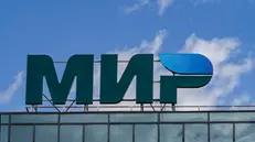 epa09944455 A logo of Russian payment system Mir on the roof of a building in Moscow, Russia, 13 May 2022. Russian payment system Mir launched in 2015. It was created as an alternative to foreign payment systems, independent of external political and economic factors. Mir's operator is the National Payment Card System (NSPK), owned by the Central Bank. All payments within the system are made in rubles. EPA/YURI KOCHETKOV