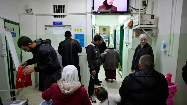 epa11171859 Palestinian refugees wait inside a clinic in the Palestinian refugee camp of Mar Elias that is run by the United Nations Relief and Work Agency (UNRWA) in Beirut, Lebanon, 20 February 2024 (issued 22 February 2024). The doctor in charge, Hassan Mohammad Saleh, explains that the center is the "only way" for between 5,000 and 6,000 people to receive medical care. "The frequency of patients coming to the clinic indicates the need, because before they were self-financing. But with the economic crisis in Lebanon, the collapse of the Lebanese pound, they had to return to the service of UNRWA," Saleh added. Every day, between 75 and 100 patients with chronic diseases such as diabetes, hypertension or heart problems pass through this clinic; in addition to pregnant women, children who need to be vaccinated and patients suffering from common ailments such as diarrhea or flu. In Lebanon, where there are some 250,000 Palestinian refugees, the UN agency will only be able to continue helping until the end of March due to suspensions of funding to UNRWA after Israel accused some workers of participate in the Hamas attacks on 07 October 2023. Several major donors, the United States and Germany among them, suspended funding to the agency pending the UNâ€™s investigation into the matter. EPA/WAEL HAMZEH