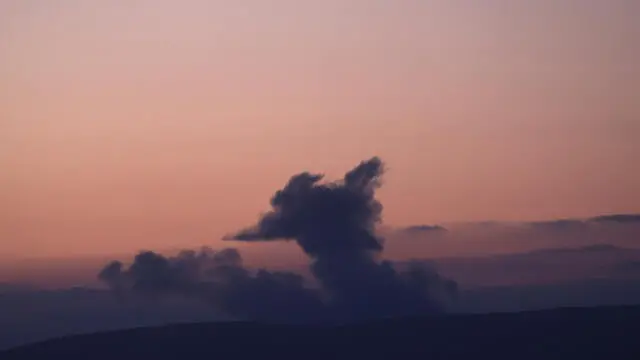 epa11652993 Smoke rises as a result of fighting between Israel and Hezbollah in southern Lebanon as seen from northern Israel, 10 October 2024. Israel's military stated that around 105 projectiles were fired by Hezbollah from Lebanon into Israel on 10 October. EPA/ATEF SAFADI