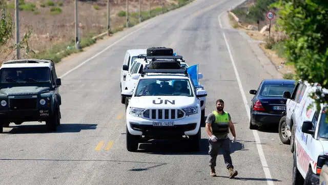 epa11579917 Vehicles of the United Nations Interim Forces in Lebanon (UNIFIL) are seen near the site where the Israeli drone strike targeted a vehicle on the road leading to the Lebanese coastal town of Naqoura near the border with Israel in southern Lebanon, 02 September 2024. Lebanon's state-run news agency (NNA) reported, that two people were killed in the Israeli drone strike. The targeted vehicle on the Naqoura highway belongs to a company that provides services contracted with UNIFIL. EPA/STR