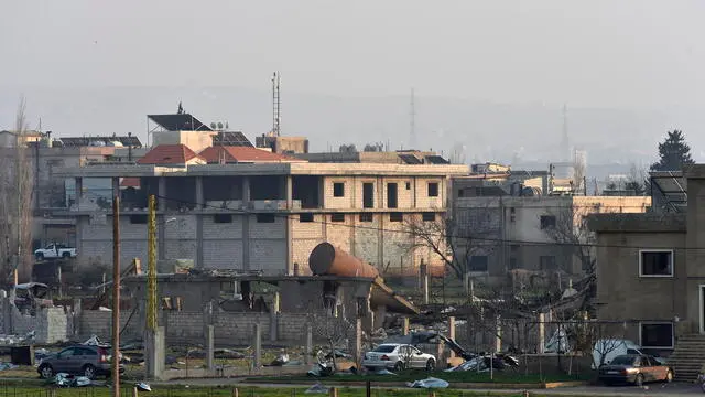 epa11182966 A damaged structure after an Israeli air strike near Baalbek, the Beqaa Valley, Lebanon, 26 February 2024. Israel Defense Forces (IDF) said on 26 February fighter jets struck sites used by Hezbollah's Aerial Defense Array in Beqaa valley. Hezbollah said two of its fighters were killed in the Beqaa region. EPA/WAEL HAMZEH