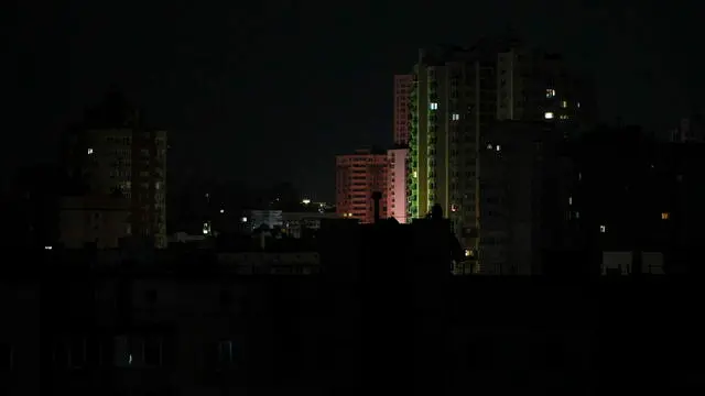 epa11566035 A residential area during an electricity blackout in Kyiv, Ukraine, 26 August 2024, after Russian shelling of all Ukraine territory. The main targets of shelling were electricity objects, Ukrainian President Volodymyr Zelensky wrote on his Telegram channel that Ukraine experienced 127 missiles and 109 drones attack. The attack targeted critical civilian infrastructure across the country, resulting in casualties and injuries. The Ukrainian president expressed his condolences to the victims' families and assured that injured people are receiving necessary assistance. Russian troops entered Ukrainian territory on 24 February 2022, starting a conflict that has provoked destruction and a humanitarian crisis. EPA/SERGEY DOLZHENKO