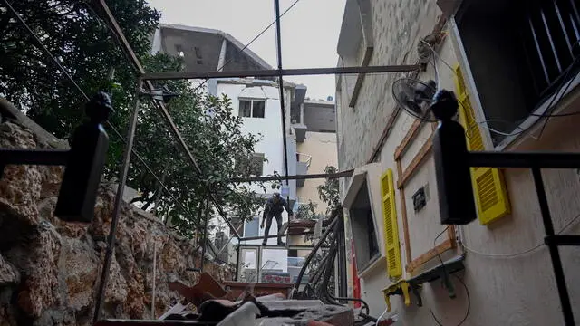 epa11174544 A view of a damaged building one day after it was targeted by an Israeli drone strike in the town of Kfar Roummane, near the town of Nabatiyeh, southern Lebanon, 23 February 2024. Lebanese state media said at least two Hezbollah fighters were killed and three others wounded after an Israeli drone launched two guided missiles on a residential building in the town of Kfar Roummane on 22 February. The Israeli army did not comment on the incident. EPA/WAEL HAMZEH