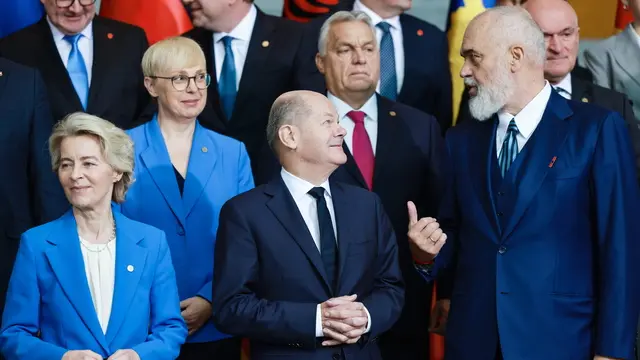 epa11658201 Prime Minister of Albania Edi Rama (R) talks to German Chancellor Olaf Scholz (C) beside European Commission President Ursula von der Leyen (L) during a family photo at the 10th 2024 Berlin Process Summit at the Chancellery in Berlin, Germany, 14 October 2024. Chancellor Scholz will hold two working meetings and a working lunch with the participants on the topics of 'Regional Cooperation and Common Regional Market', 'Green Agenda for the Western Balkans, Connectivity, and Energy' and the future direction of the Berlin Process.Â EPA/Hannibal Hanschke