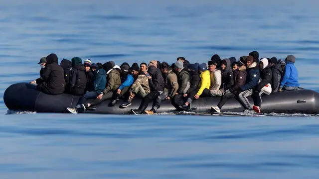 epa11202048 Around 60 migrants cross the English Channel on a small boat, on 06 March 2024. The UK government has suffered more setbacks at the House of Lords recently on its plan to send migrants to Rwanda to deter the Channel crossings. Despite the British and French government's efforts to prevent migrants from making the dangerous journey on small boats, many are willing to take the risk to claim asylum in the UK. EPA/TOLGA AKMEN