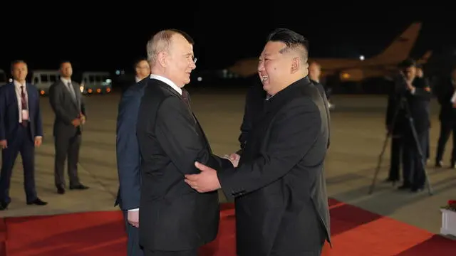 epa11421416 A photo released by the official North Korean Central News Agency (KCNA) shows Russian President Vladimir Putin (L) received by North Korean leader Kim Jong Un upon arrival at the airport of Pyongyang, North Korea, 18 June 2024 (issued 19 June 2024). The Russian president is on a state visit to North Korea from 18-19 June at the invitation of the North Korean leader. He last visited North Korea in 2000, shortly after his first inauguration as president. EPA/KCNA EDITORIAL USE ONLY EDITORIAL USE ONLY